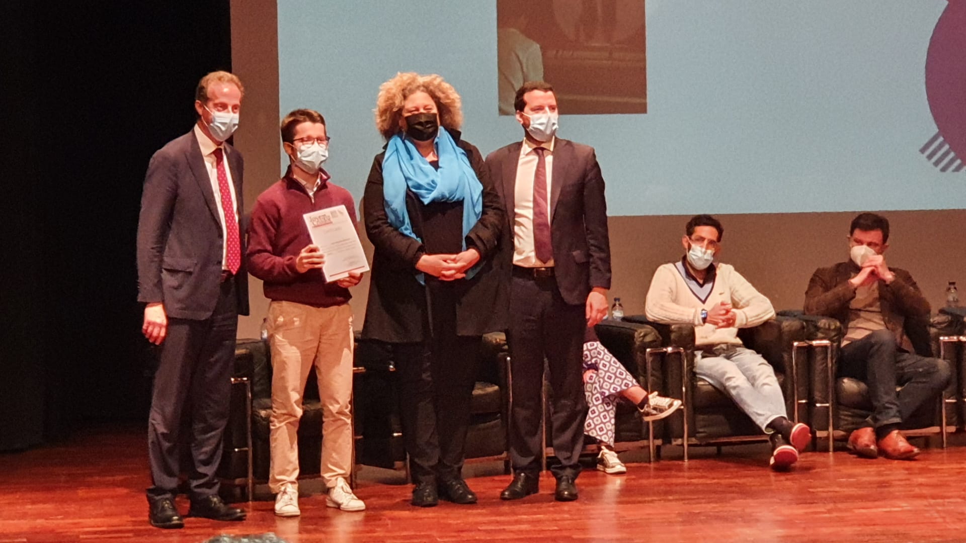 Photo receiving an award side by side with the city Mayor and imporant figures in the Music community
